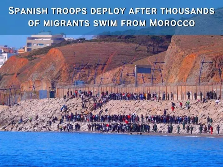 spanish troops deploy after thousands of migrants swim from morocco n.